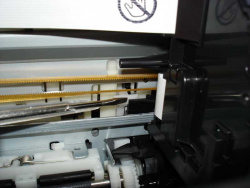 To release the print head lock: Gently push the white lever to the back,...