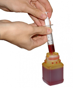 Get ink: Fill the syringe with the proper amount of ink.