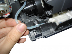 After fastening the printing unit: Don´t forget to reconnect the cleaning unit´s hose in it´s correct position.